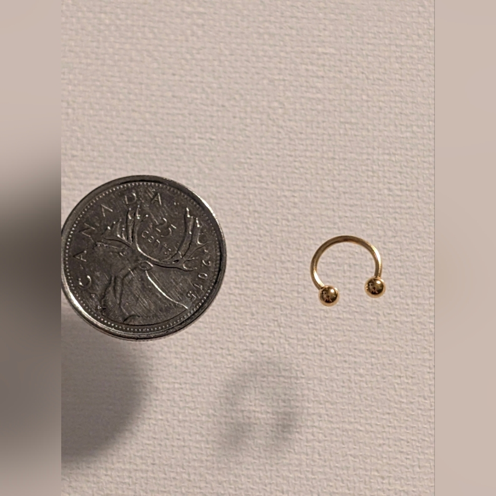 Elegant Gold Piercing Ring